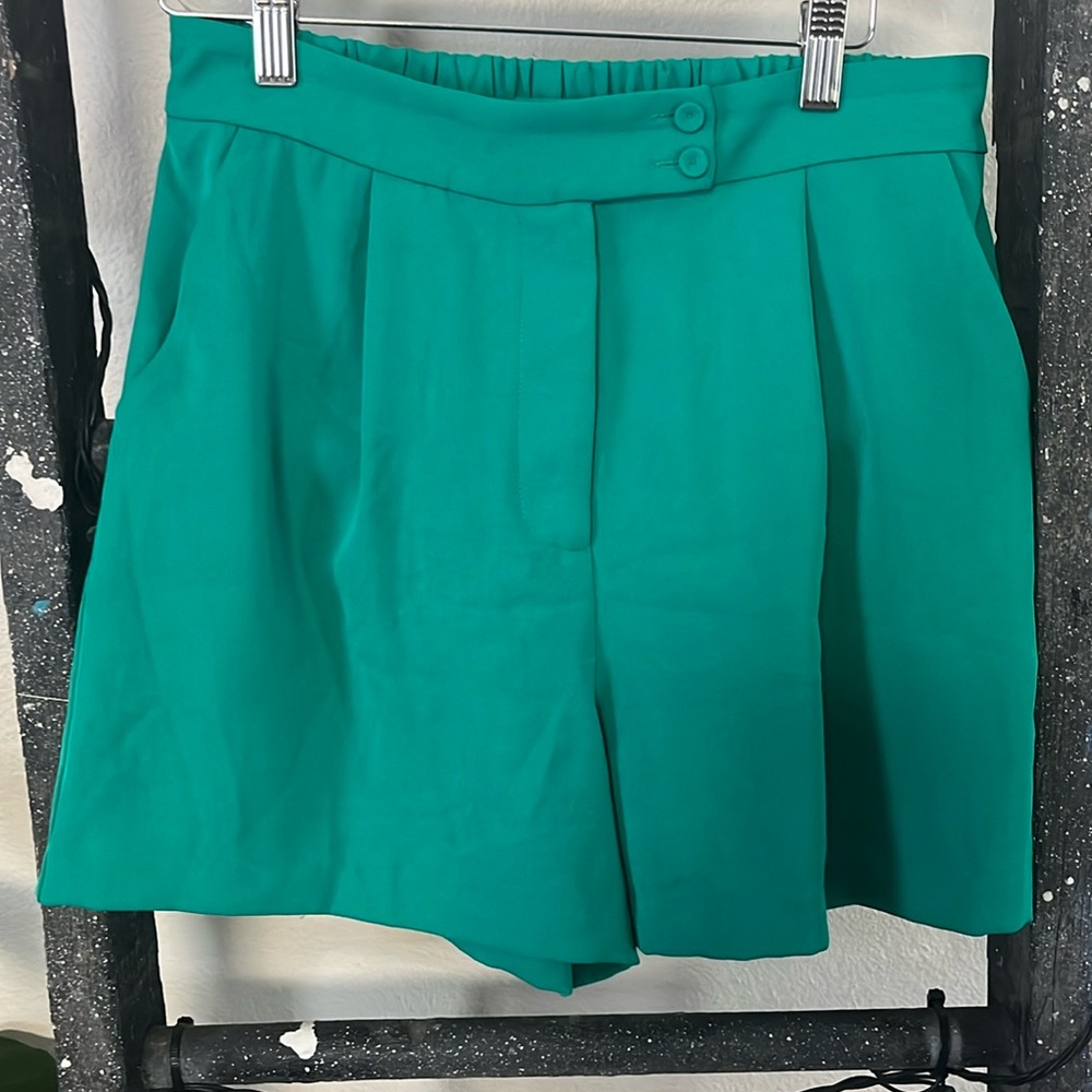 Green shorts. They are a vibrant green.